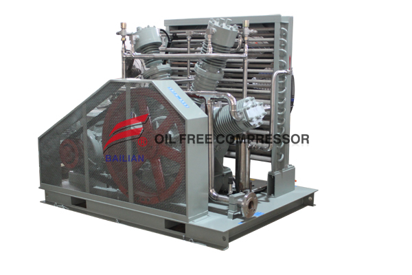 Industrial oil free helium compressor installation showing piping and modulation valves